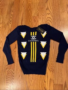 CHANEL Knot Off Navy Blue Sweater with Yellow and White Chevron Accents